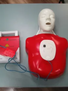 AED Trainer with Pads on Child