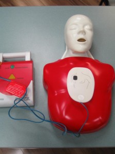 CPR mannequin and AED with First Aid Certification